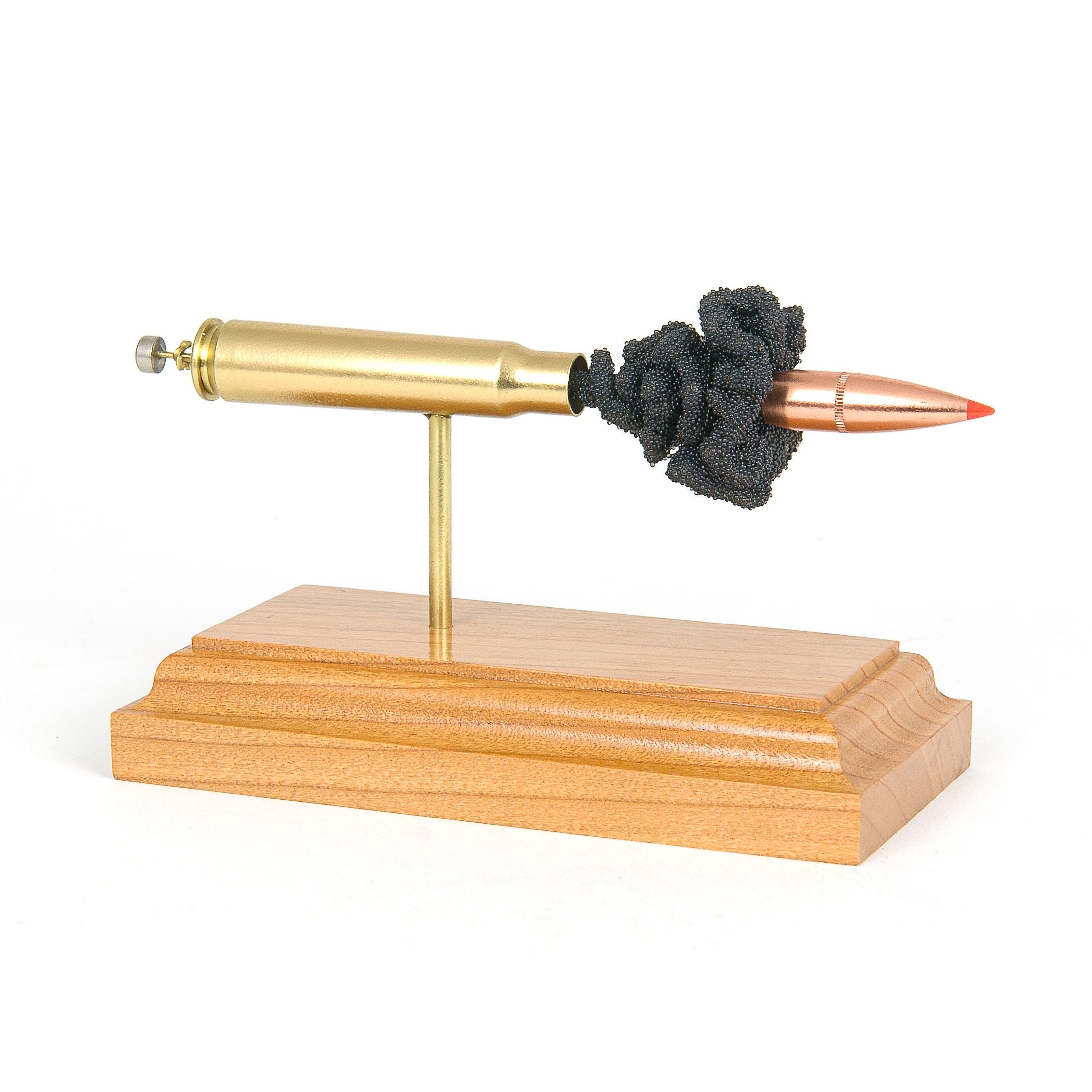 Expanded 8mm Mauser 7.92x57 cartridge display on hardwood base