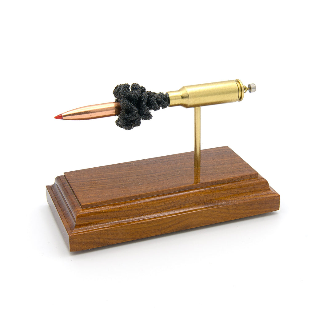 Sectioned 6.5 Grendel cartridge showing primer case powder and 123gr ELD-Match bullet aligned horizontally