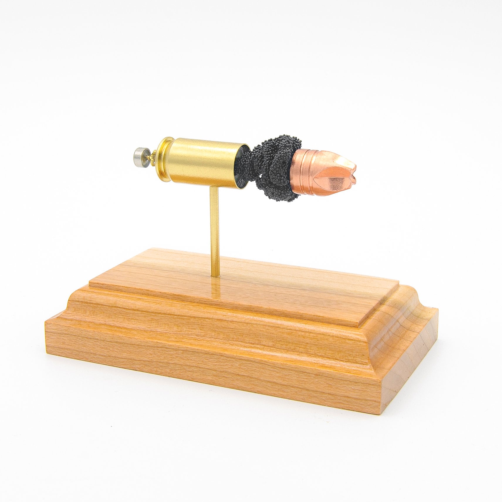 Sectioned 45 Auto Lehigh Xtreme Defense cartridge showing primer case powder and fluted bullet aligned horizontally