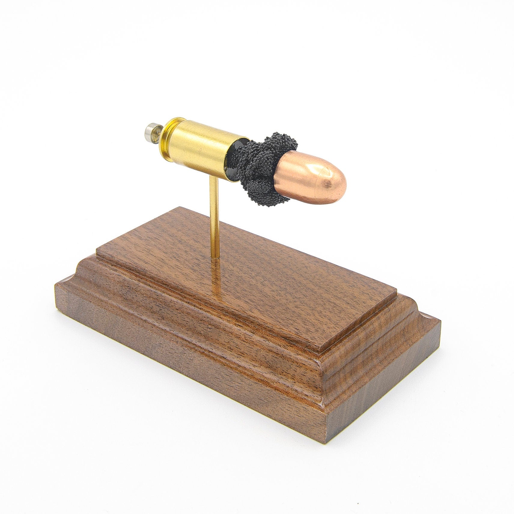 Expanded .45 Auto 230gr copper FMJ cartridge display on walnut wood base