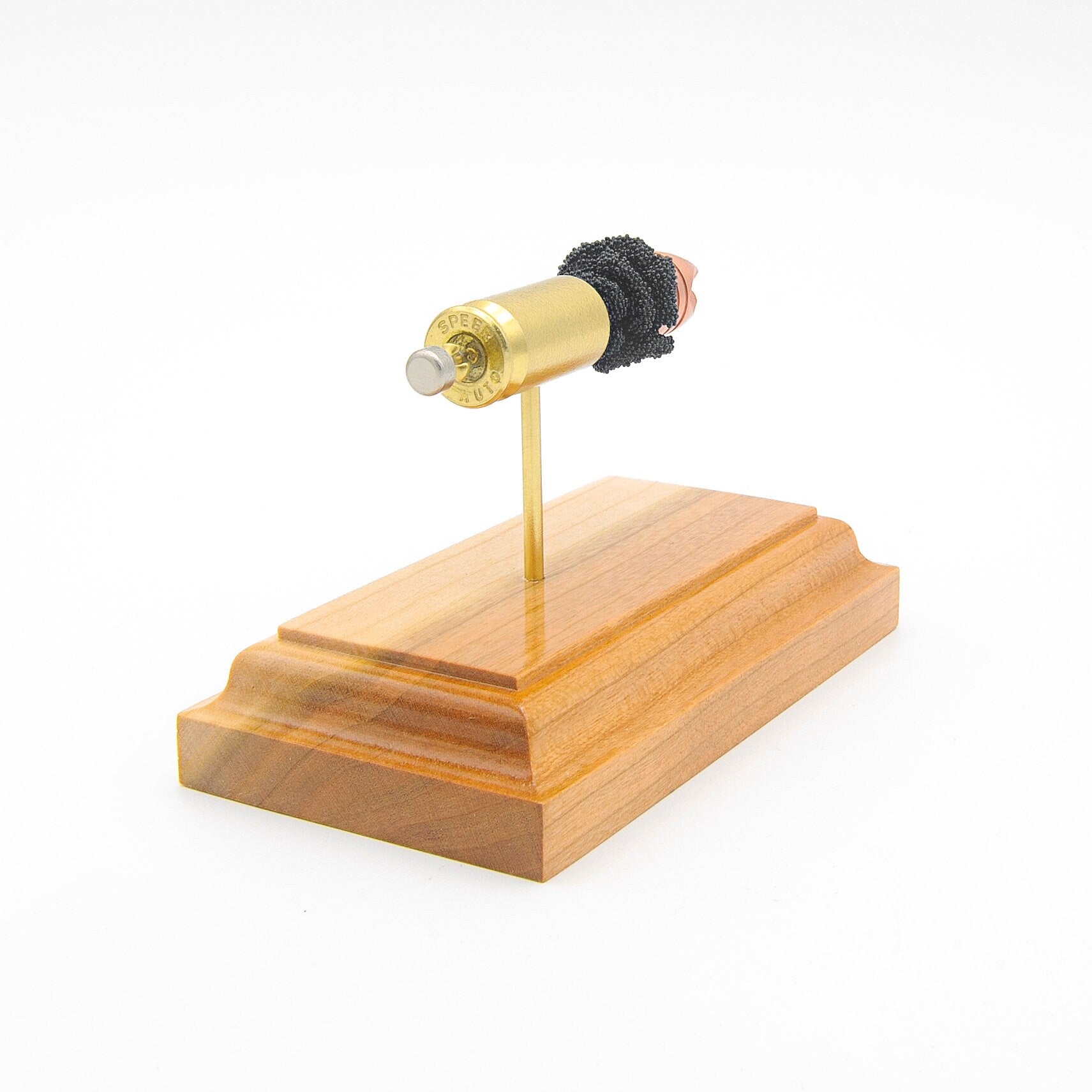 45 Auto 120gr Xtreme Defense cutaway cartridge display mounted on hardwood base