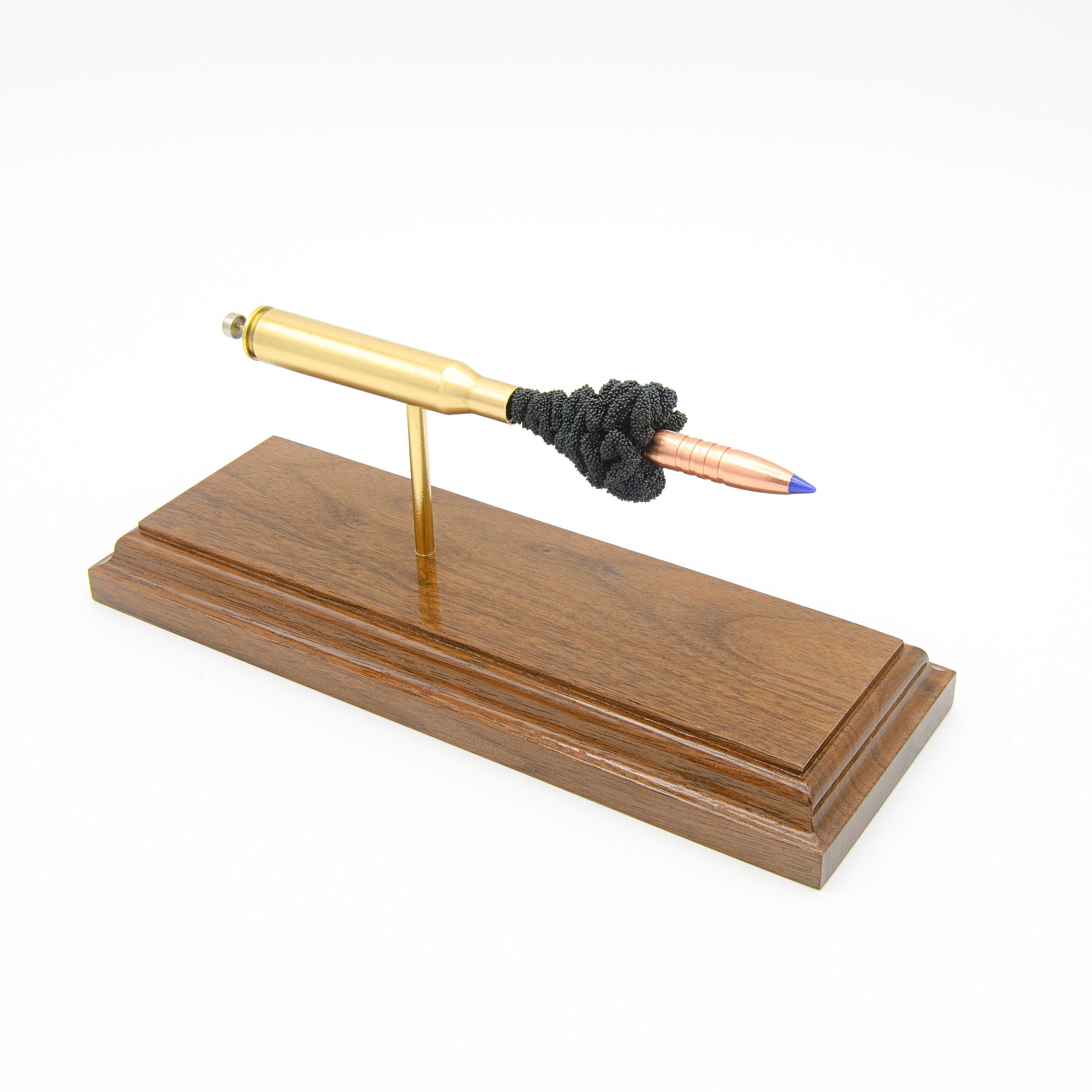 Expanded 270 Win Barnes TTSX cartridge display on hardwood base