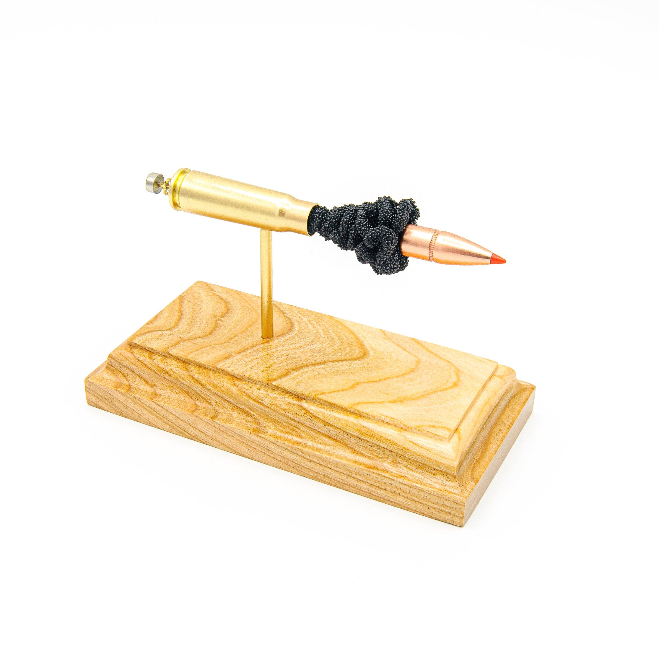 7.62x39mm Hornady 123gr SST expanded cartridge display on hardwood base