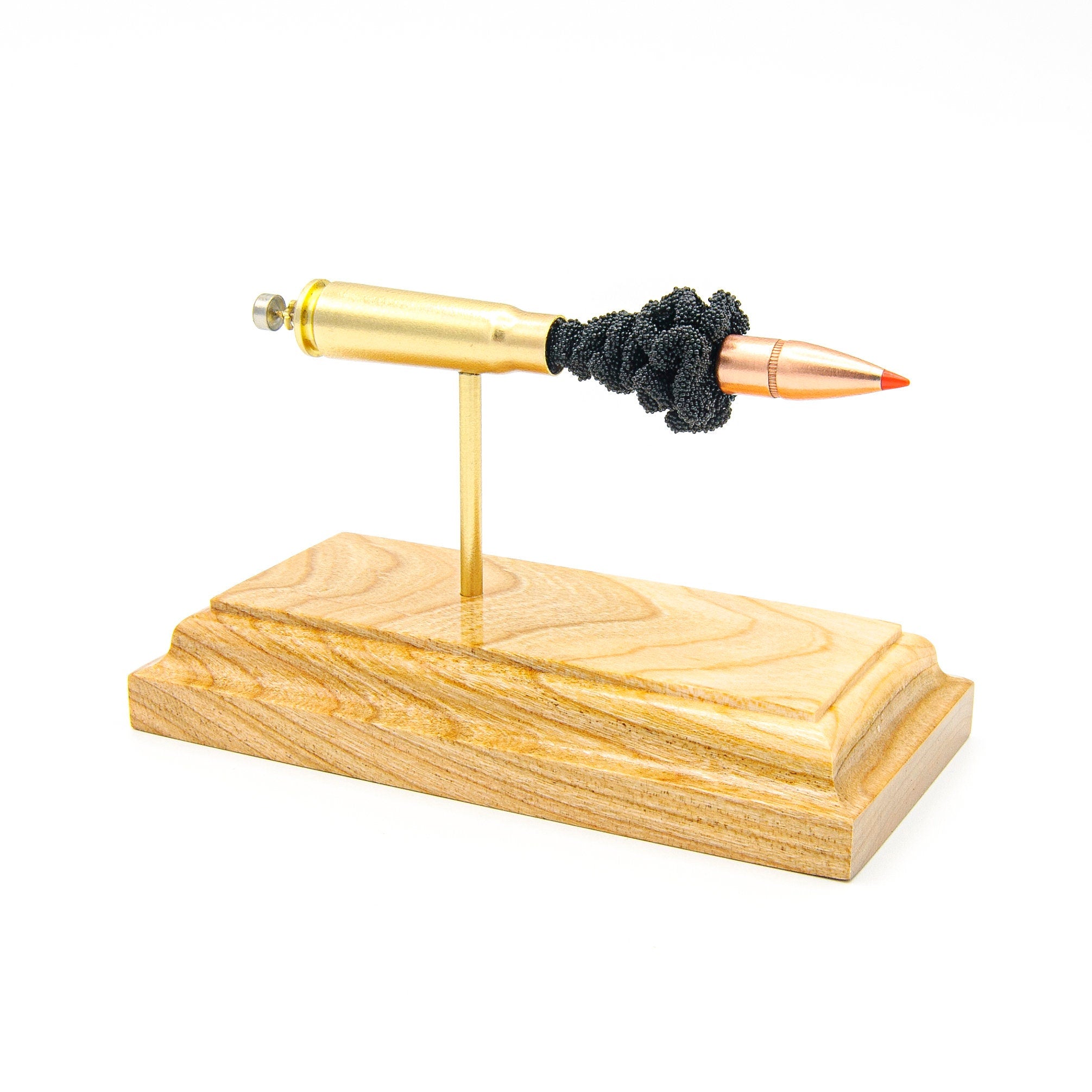 Handmade 7.62x39mm Hornady SST cartridge display aligned on solid wood base