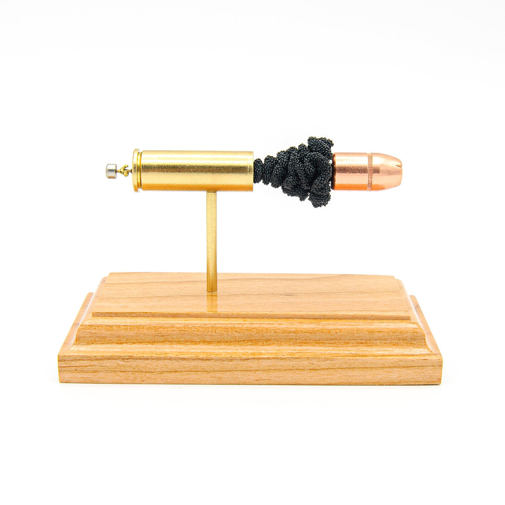 Sectioned 454 Casull cartridge showing primer case powder and 300gr XTP Mag bullet aligned horizontally