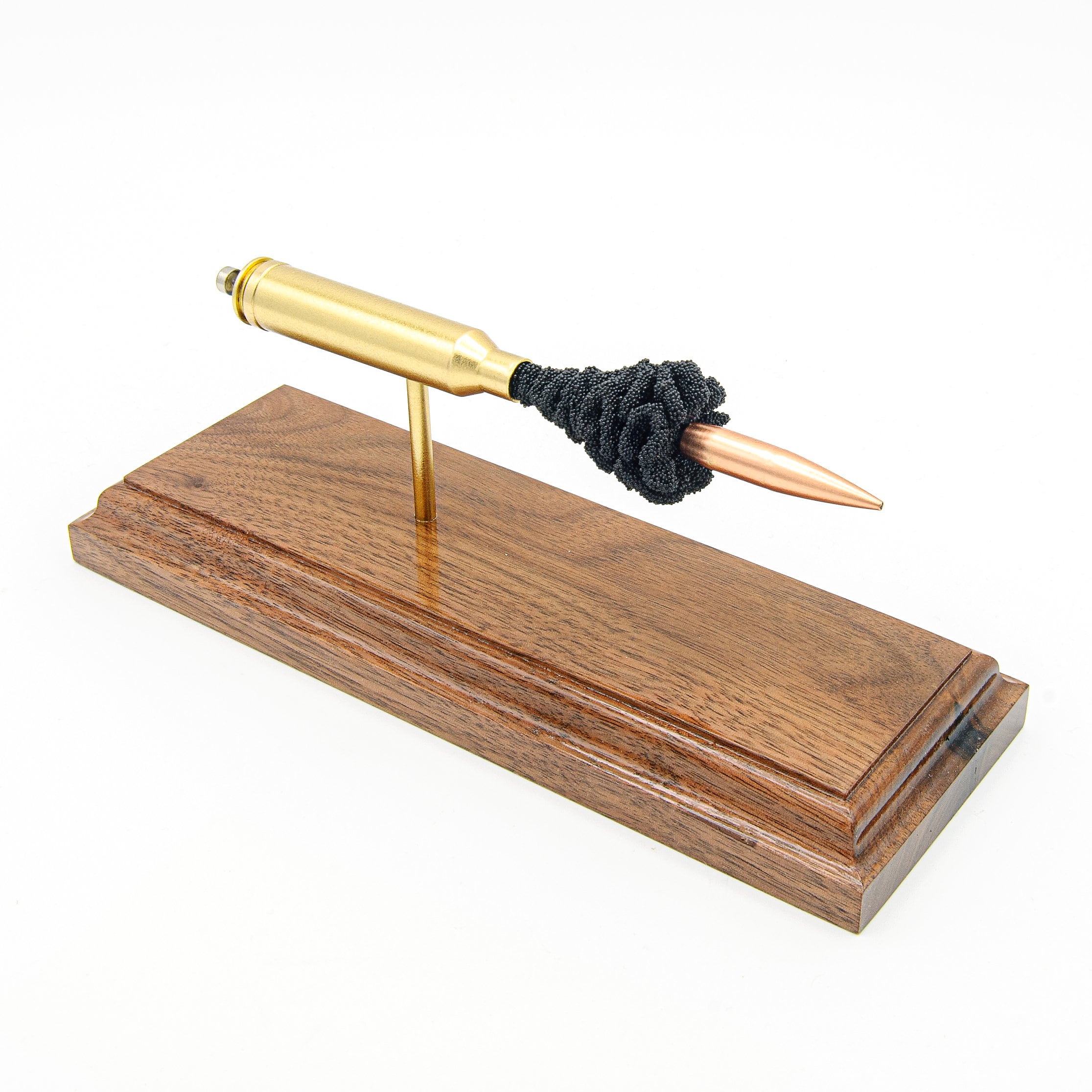 7mm Remington Magnum 168gr Berger expanded cartridge display on hardwood base