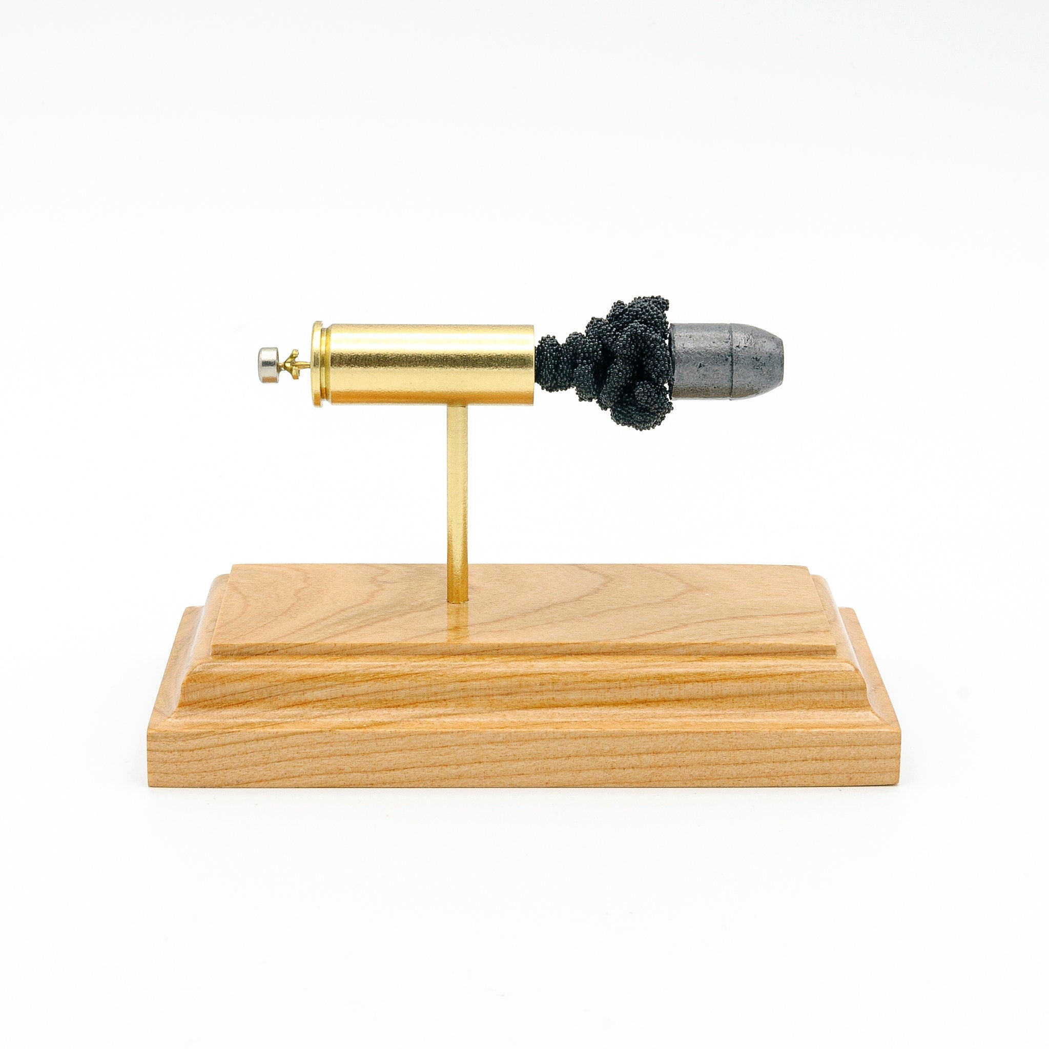 45 Colt 250gr Lead Flat Nose expanded cartridge display model on hardwood base