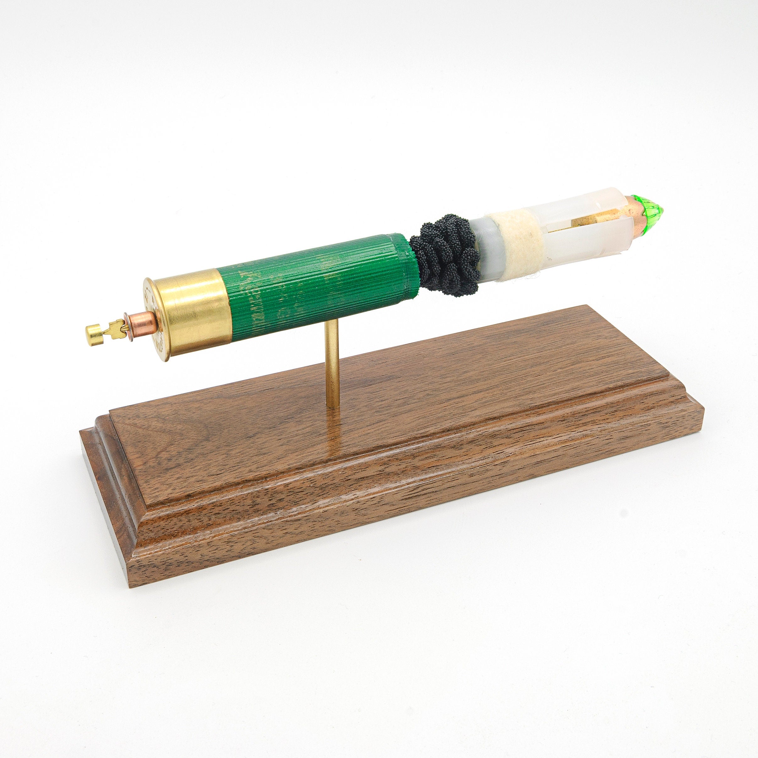 inert 12ga slug shotshell display on hardwood base