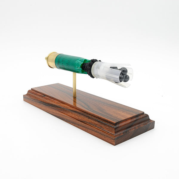 Expanded 12 gauge Remington buckshot shotshell display on Bolivian rosewood base