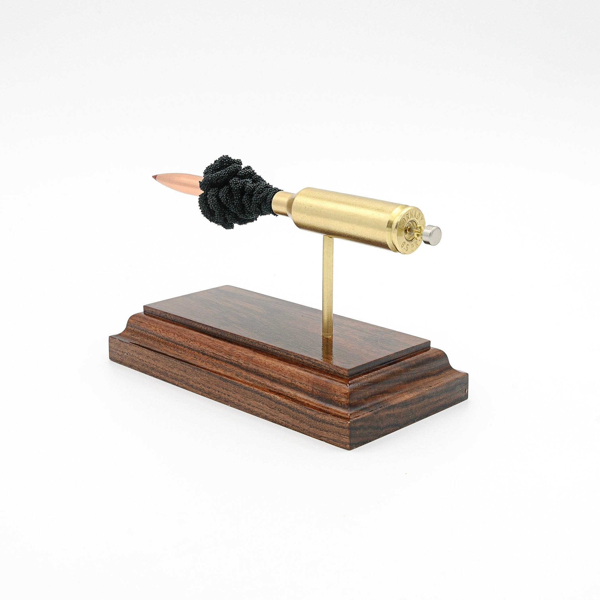 Handmade 6.5 PRC ammunition component display aligned on hardwood base for training and decor