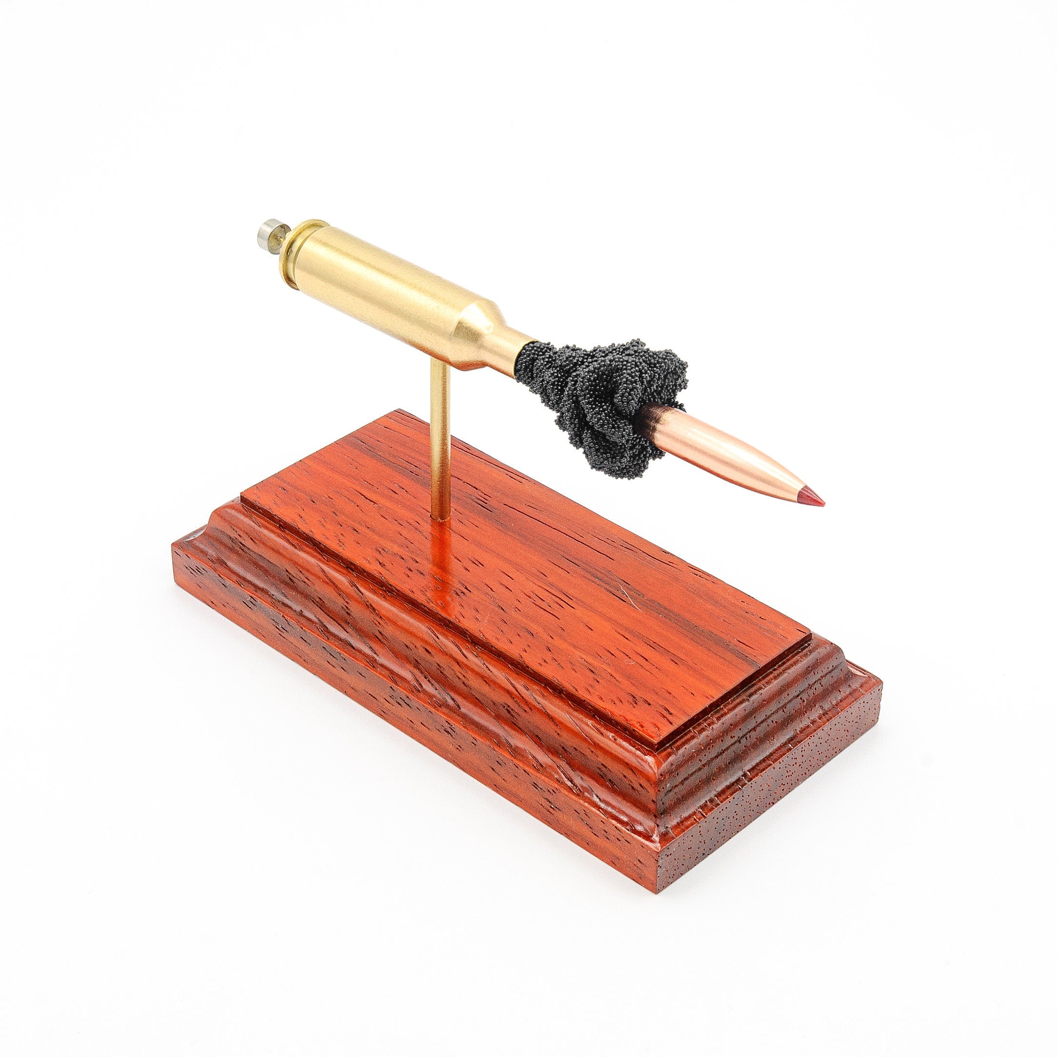 6mm Creedmoor Hornady 103gr ELD-X expanded cartridge display on hardwood base