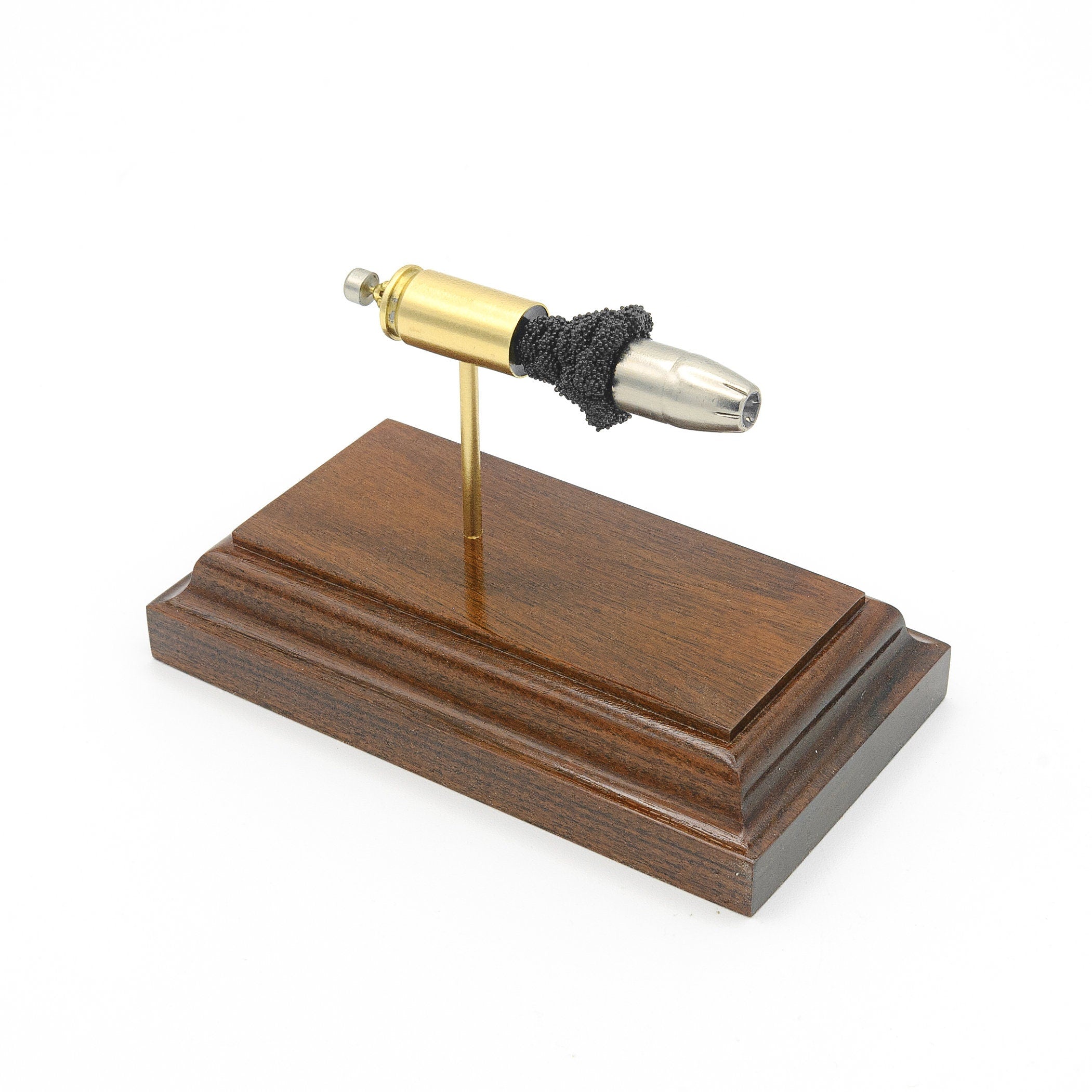 9mm Luger 147gr Winchester SilverTip expanded cartridge display on rosewood base