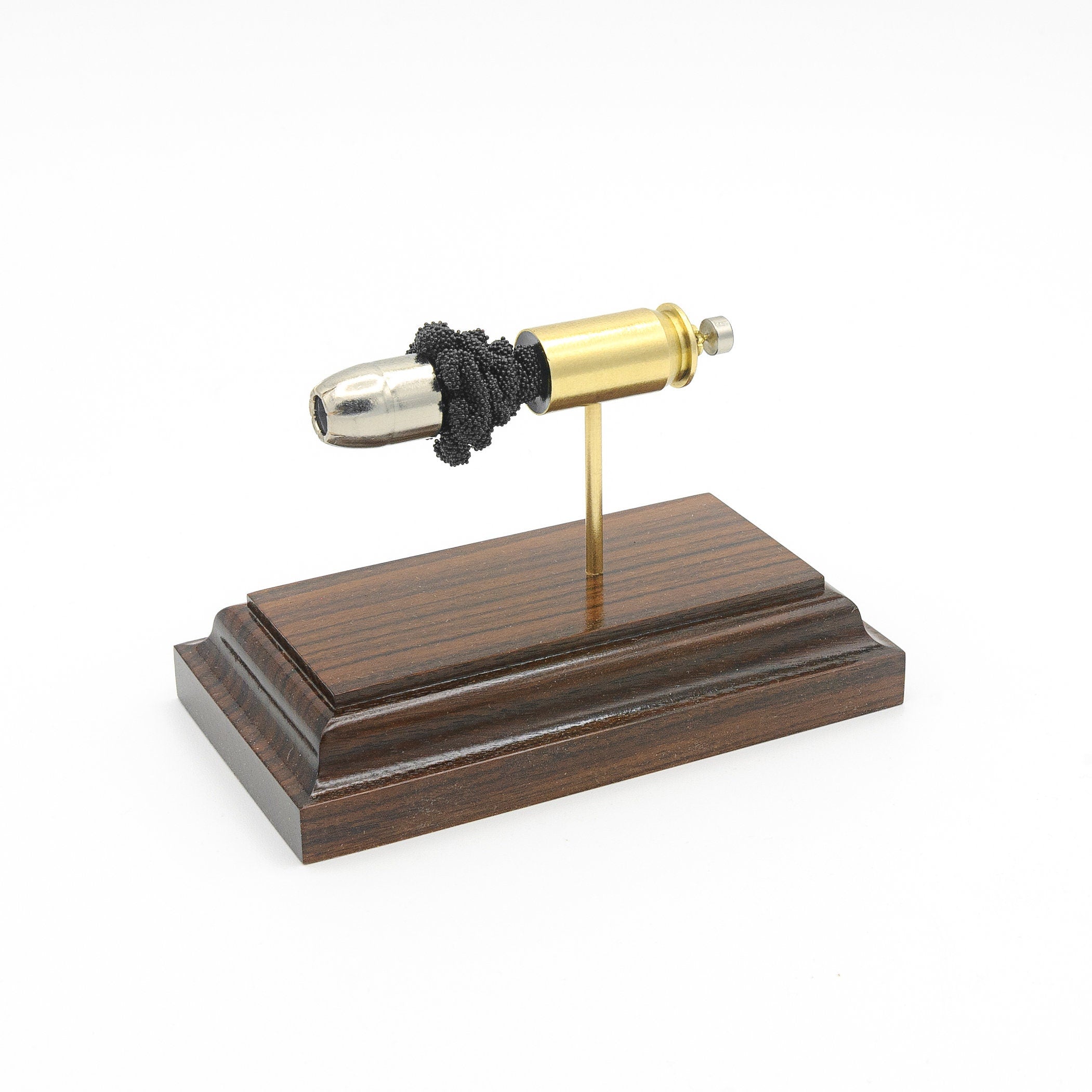 Sectioned 45 Auto SilverTip cartridge showing primer case powder and hollow point bullet aligned horizontally