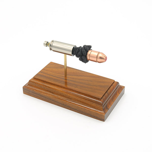 Expanded 10mm Auto Hornady Critical Duty cartridge display on Bolivian rosewood base