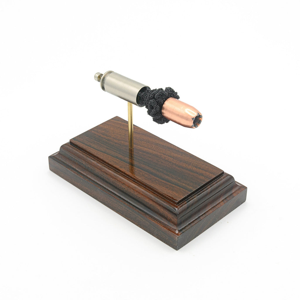 Expanded 10mm Auto Speer Gold Dot cartridge display on Bolivian rosewood base