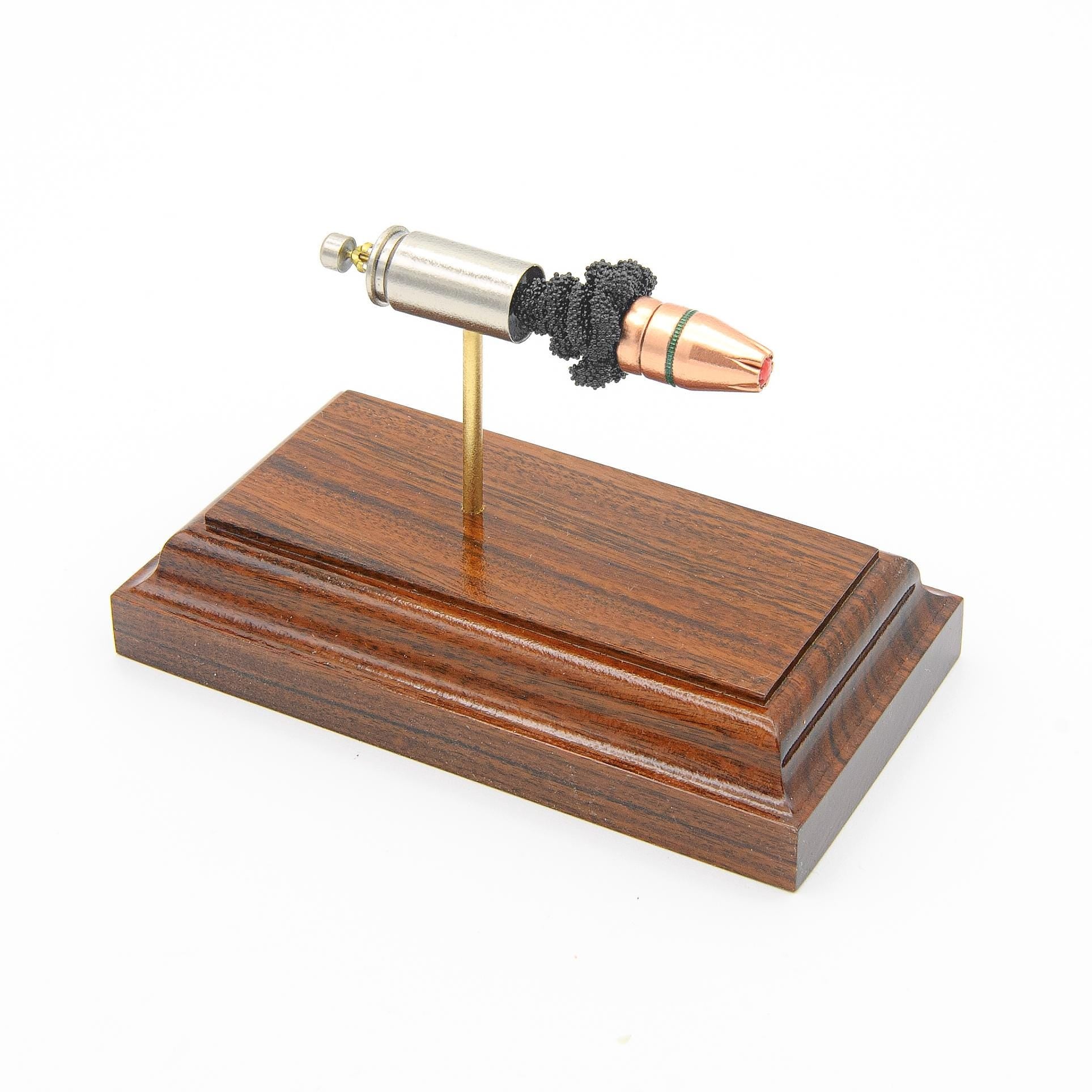 9mm Luger 124gr FlexLock Hornady Critical Duty expanded cartridge display on rosewood base