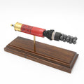 Expanded 12 gauge Winchester Super-X shotshell display on Bolivian rosewood base