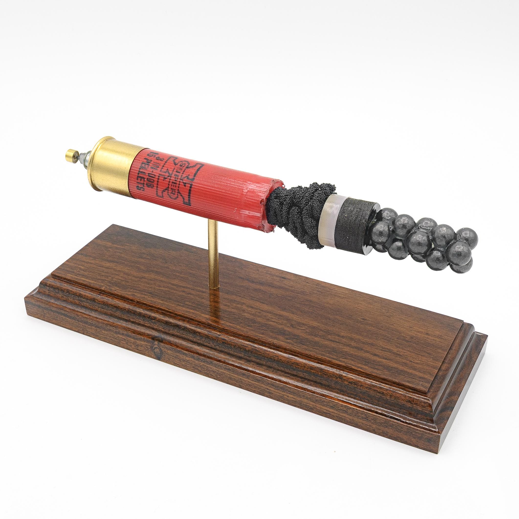 Expanded 12 gauge Winchester Super-X shotshell display on Bolivian rosewood base