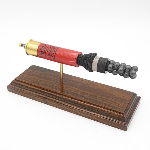 Expanded 12 gauge Winchester Super-X shotshell display on Bolivian rosewood base