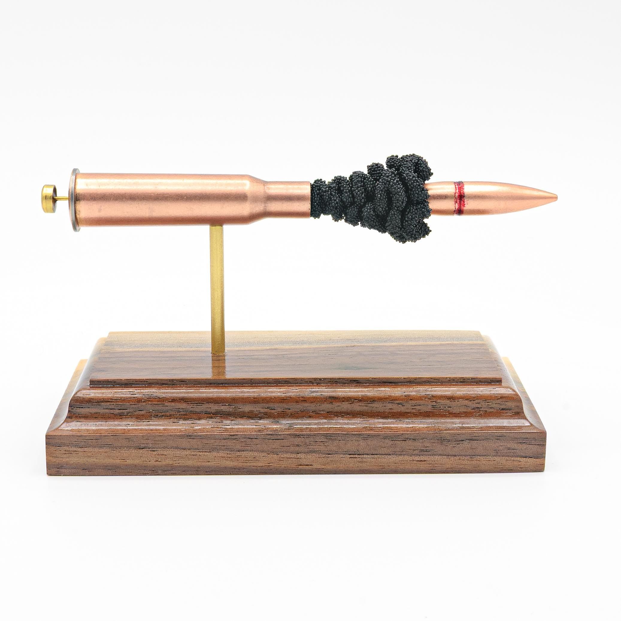 Handmade 7.62x54R surplus cartridge display aligned on solid wood base