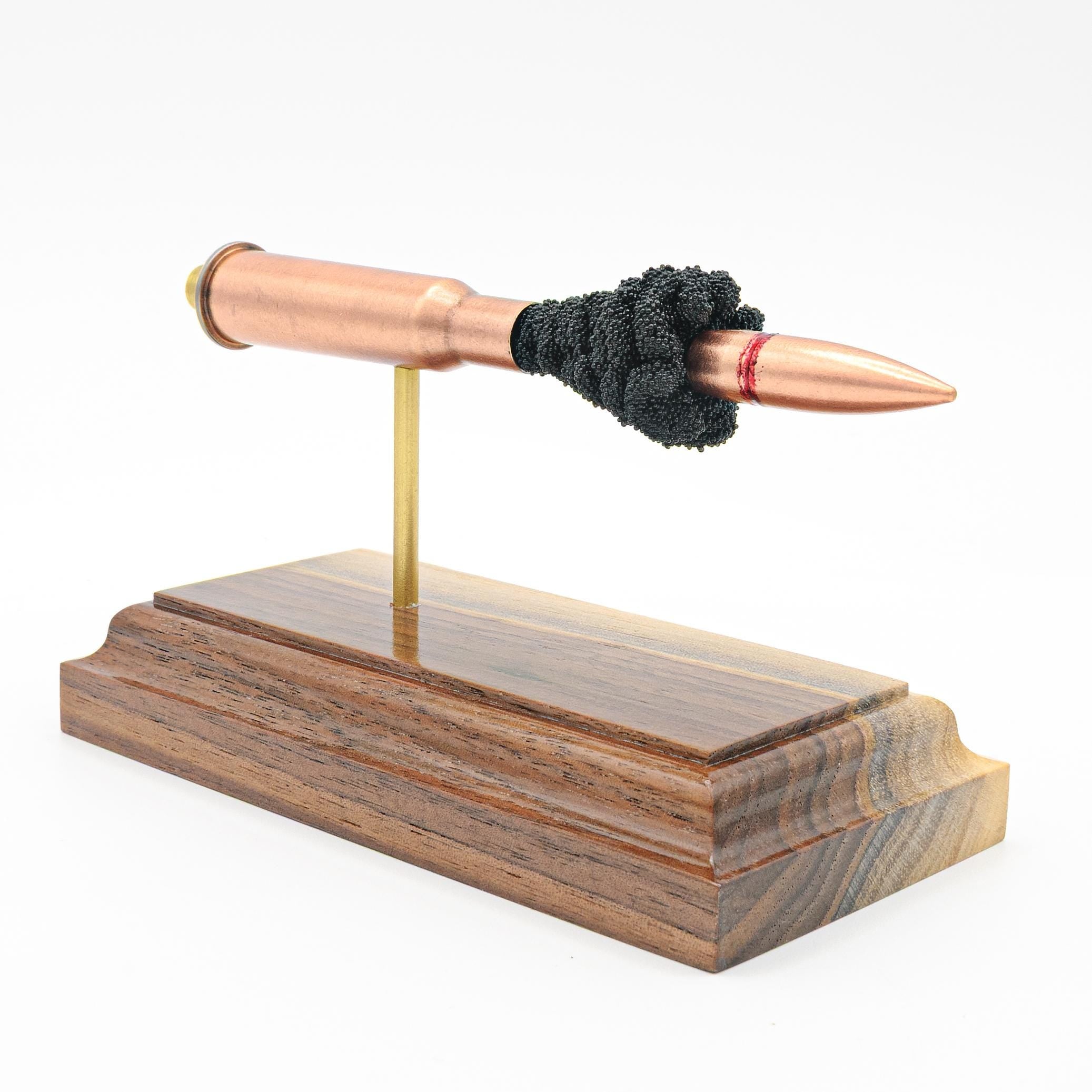 7.62x54R surplus FMJ expanded cartridge display on walnut hardwood base