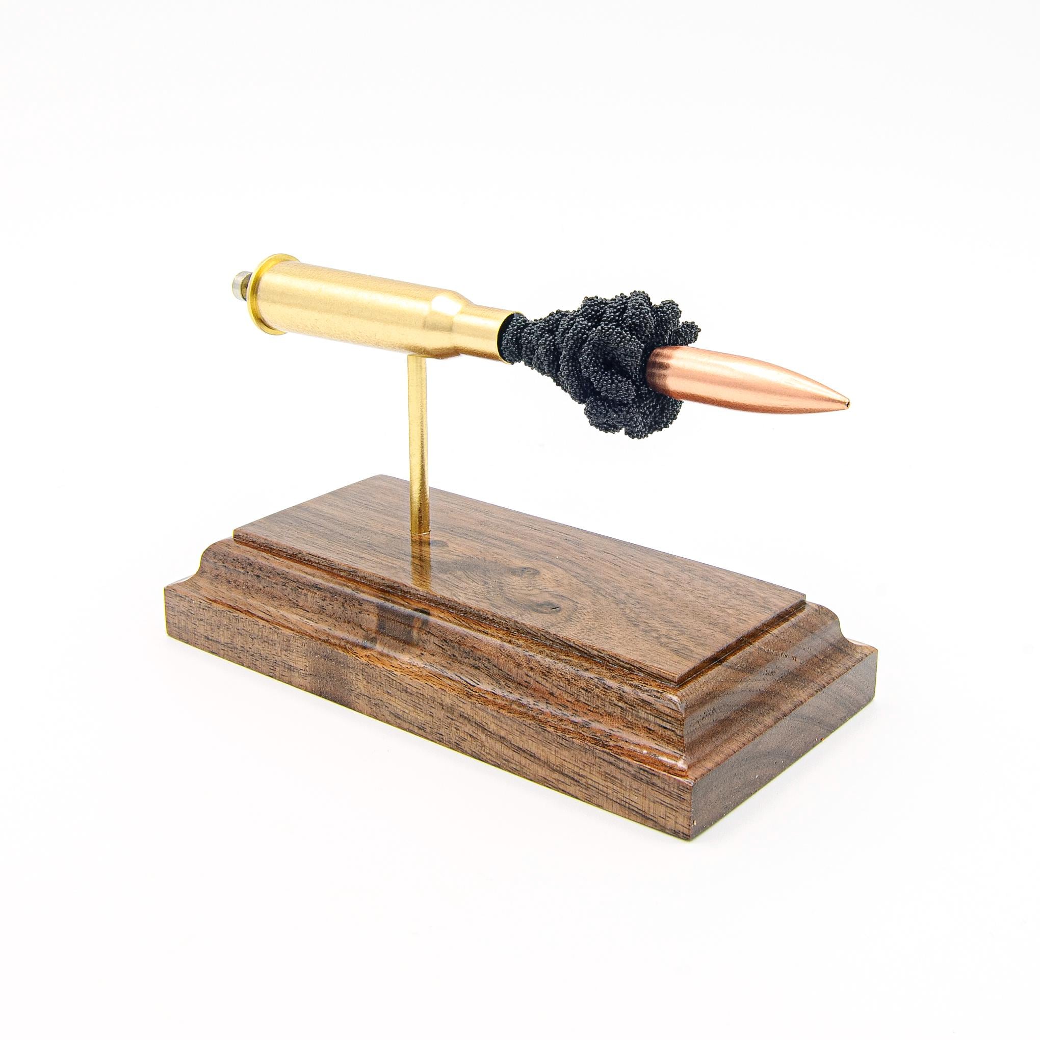 Handmade 7.62x54R ammunition display mounted on a walnut wood base