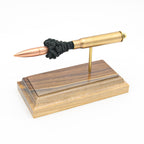 Handmade 8mm Mauser surplus cartridge display aligned on solid wood base