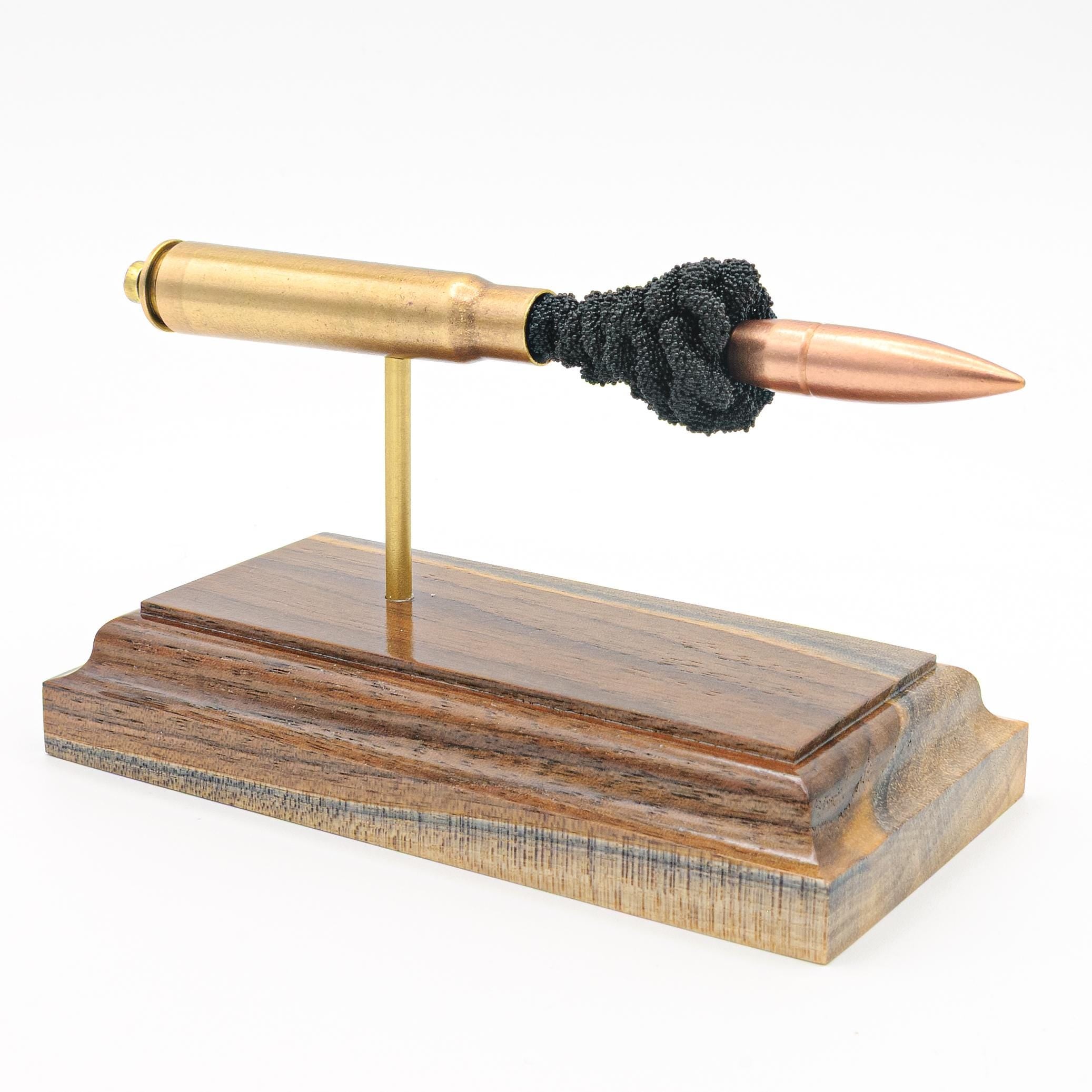 8mm Mauser 7.92x57mm surplus expanded cartridge display on walnut base