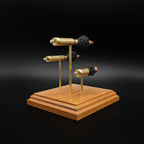 Rear three-quarter view of a handcrafted triple caliber anatomy ammunition display featuring a .308 Winchester 168gr Sierra MatchKing HPBT, 5.56×45mm M855 Green Tip, and .45 Auto 220gr Sierra FMJ mounted on a cherry wood base.